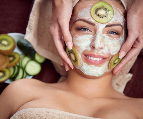 Natural,Cosmetic,Mask,With,Cucumber,And,Kiwi,On,Face,Of